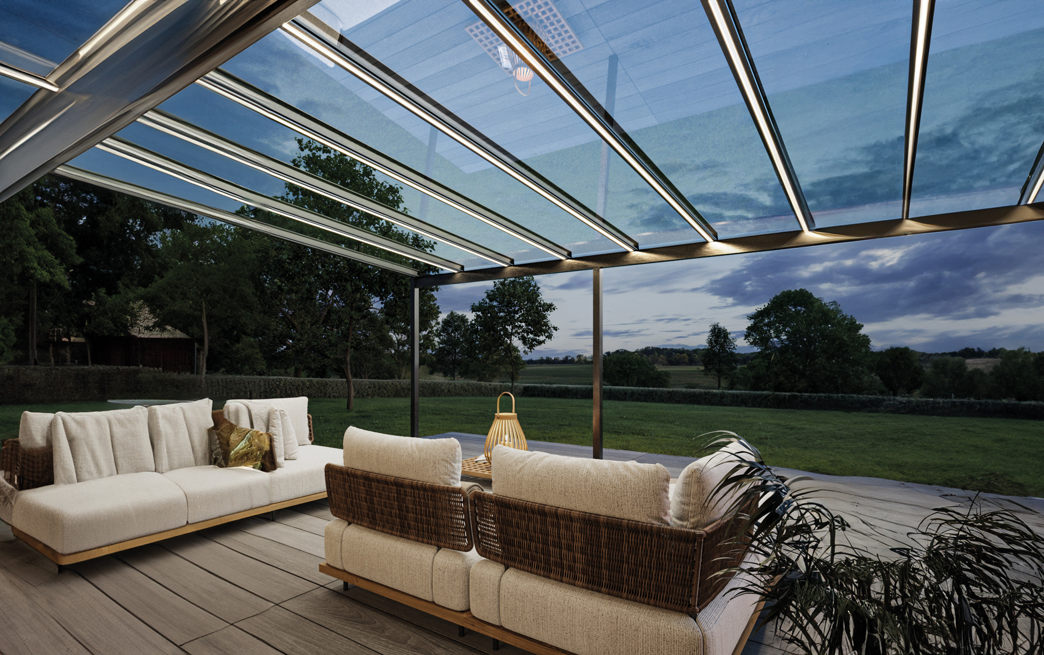 Moderne Terrasse mit bequemen Sofas, Rattan-Details und Pflanzen, unter einer stilvollen Überdachung.